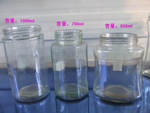 廠家供應多種規(guī)格蜂蜜玻璃瓶，配套瓶蓋