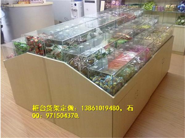 常州零食专卖店展示柜定做供应常州零食专卖店展示柜定做，木质零食柜台货架批发，展示柜定做厂家